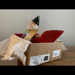 C. Louboutin- Confetti translucent-sold as is.